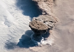 A NASA photo shows the Raikoke volcano erupting in the Kurile Islands near the Kamchatka Peninsula in June 2019.