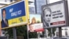Kiyevdə prezidentliyə namizədlər (soldan-sağa) Serhiy Tihipko, Petro Poroshenko və Yulia Tymoshenkonun seçki plakatları. 20 may 2014