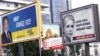 Election billboards for presidential candidates Serhiy Tihipko (left to right), Petro Poroshenko, and Yulia Tymoshenko are seen in the Ukrainian capital, Kyiv.