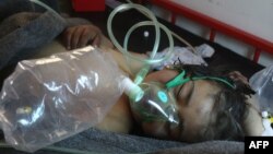 A Syrian child receives treatment at a small hospital in the town of Maaret al-Noman following a suspected toxic-gas attack in Khan Sheikhun, a nearby rebel-held town in the northwestern Idlib province, in April.