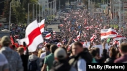 Tens of thousands of opposition supporters are estimated to have marched through the streets of Minsk on September 13.