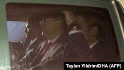TURKEY -- U.S. pastor Andrew Brunson (C) travels in a police vehicle escorted by Turkish police as he enters Aliaga Prison Court at Aliaga District in Izmir, October 12, 2018