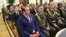 The president's son-in-law, Shamsullo Sohibov, pictured in the blue suit, controls a vast amount of wealth in Tajikistan. 