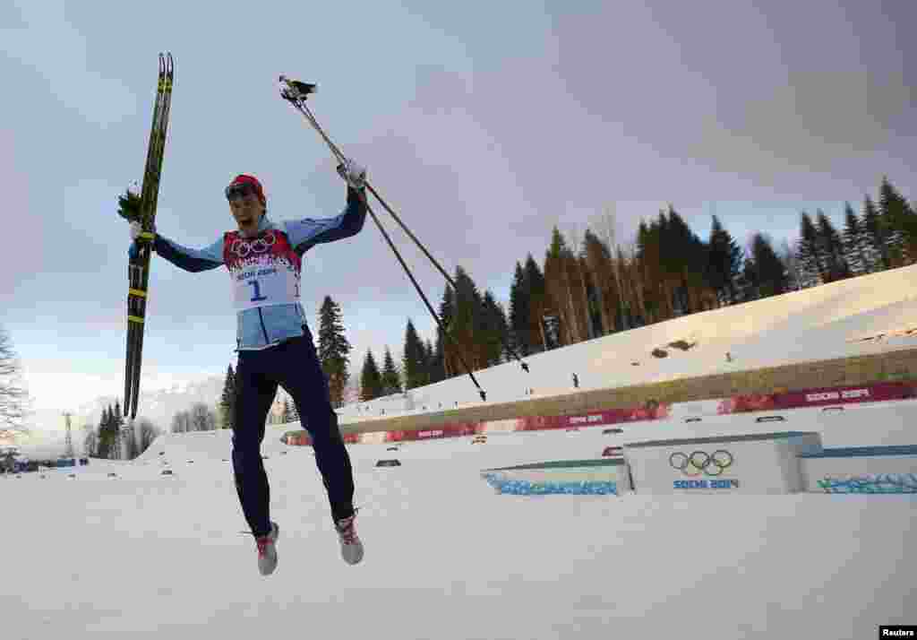 Norways Ola Vigen Hattestad celebrates after winning the men's cross-country sprint final.