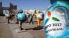 Kazakhstan -- People walk past figures symbolizing countries-participants in the Expo 2017 at downtown of Astana, host city of the next year exhibition, September 29, 2016