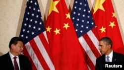 Барак Обама и Си Цзиньпин на встрече в марте 2014 года