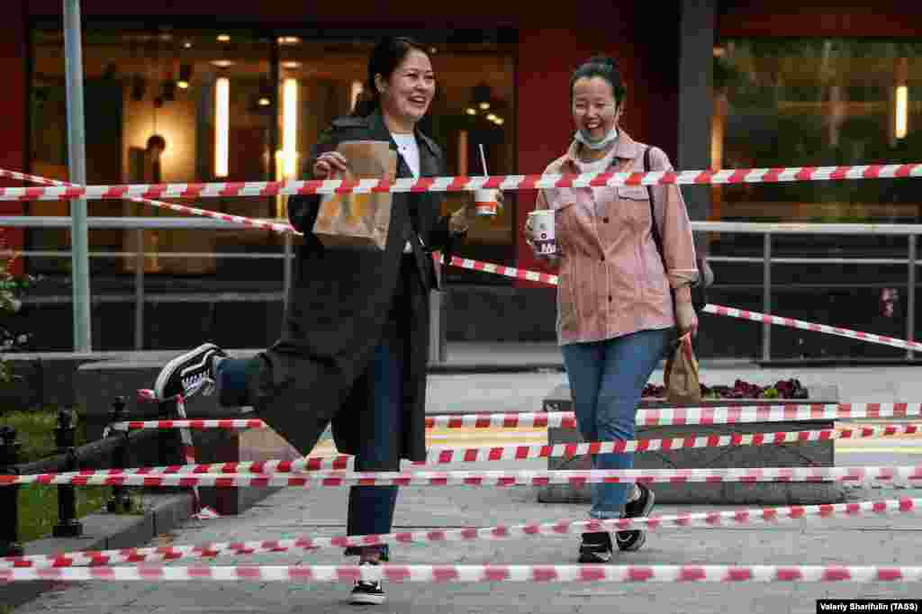 Women walk in Moscow's Novopushkinsky Square. (TASS/Valery Sharifulin)