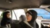 A female taxi driver fetches a passenger in Tehran, 21Aug2011