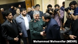 IRGC Commander-in-chief Mohammadali Jafari (C) attending the funeral for the mother of former Fars news agency CEO Hamidreza Moghadamfar (R) in Tehran, on July 31, 2018.
