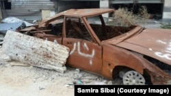 Напис «Сирія Асада» на автомобілі в Хомсі