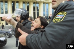 Azerbaijani riot policemen detain protesters in central Baku. (file photo)