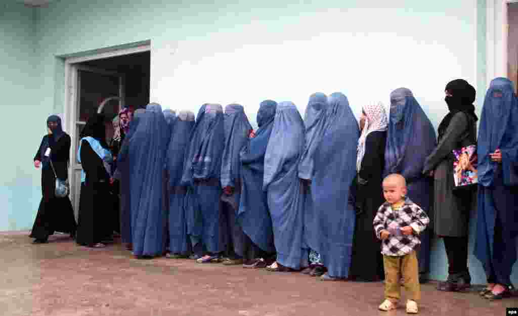 Afghan women line up to cast their ballot at a polling station during the presidential election in Takhar on April 5. (epa/Hasib Arman)