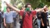 Opposition supporters march through the streets of Tehran on September 18.