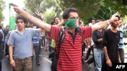 Opposition supporters march through the streets of Tehran on September 18.