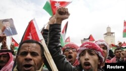 Jordan -- Supporters of Jordan's King shout slogans during a demonstration in support of the King in Amman, 25Mar2011