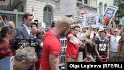 Protesters pour Russian vodka into the streets of New York on July 31.