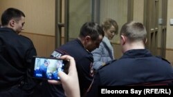 Anastasia Shevchenko is seen in the defendants' cage in a courtroom in Rostov-on-Don on January 23.