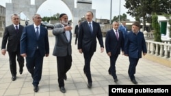 Azerbaijani President Ilham Aliyev (third from right) visited Nardaran in June, bringing gifts.