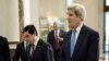 U.S. Secretary of State John Kerry, right, walks with Turkmen President Gurbanguly Berdimuhamedov before their talks at the Oguzkhan Presidential Palace in Ashgabat on November 3.