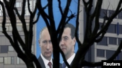 A campaign poster of Russian President Dmitry Medvedev (right) and Prime Minister Vladimir Putin appeals to people to vote for their political party, United Russia, in parliamentary elections in December.