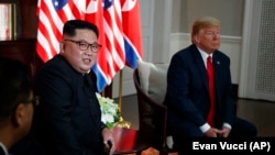 North Korean leader Kim Jong Un (left) meets with U.S. President Donald Trump on June 12 in Singapore.