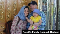 Iranian-British aid worker Nazanin Zaghari-Ratcliffe (left) poses with her husband, Richard Ratcliffe, and her daughter, Gabriella.