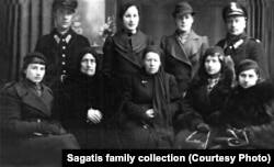 A family picture from Konstanty Bujdo's funeral in 1938 showing Alojze (top left); Wanda (top row, second from left); Jozefa (seated in center); Janina (top row, second from right); and Maria (seated second from right)