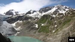 Switzerland -- Trift bridge over the Trift lake near the Trift Glacier in the Susten rock mass, 12Jun2009