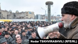 Striking "marshrutka" drivers gathered in front of their vehicles in the Georgian capital, Tbilisi, to protest on February 25.