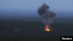 Nagorno-Karabakh -- Smoke from fire rises above the ground in Martakert district, after an Azerbaijani unmanned military air vehicle was shot down by the self-defense army of Nagorno-Karabakh, 4Apr2016.