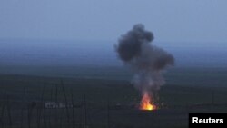 Nagorno-Karabakh -- Smoke from fire rises above the ground in Martakert district, after an Israeli-made Azerbaijani "suicide" drone was shot down by the Karabakh army, 4 April 2016.