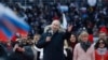 Владимир Путин во время митинг-концерта на стадионе «Лужники», 18 марта 2022 года
