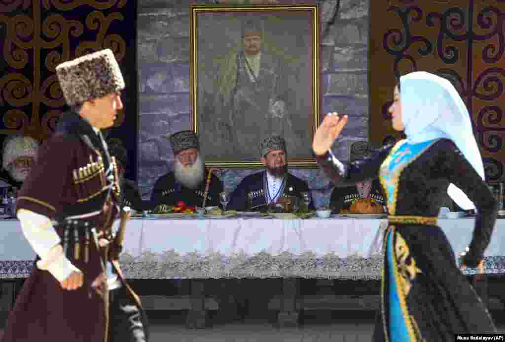 In traditional dress, Chechen leader Ramzan Kadyrov watches a dance performance during celebrations for the Day of the Chechen Language in Grozny on April 25. (AP/Musa Sadulayev)