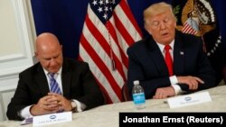 U.S. President Donald Trump (right) with national security adviser H.R. McMaster