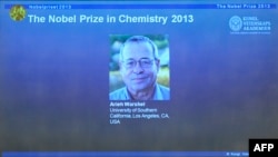 A portrait of U.S.-Israeli scientist Arieh Warshel is displayed on a screen during a press conference to announce the laureates of the 2013 Nobel Prize in Chemistry at the Nobel Assembly in Stockholm on October 9.