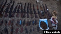 Armenia -- A screenshot of NSS video of weapons found in Mkhchian village, 8Aug2018.