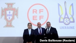 Portuguese Football Federation President Fernando Gomes (left), Spanish Football Federation President Luis Rubiales (center) and Ukrainian Football Association President Andriy Pavelko pose for photographers in Nyon, Switzerland, on October 5. 