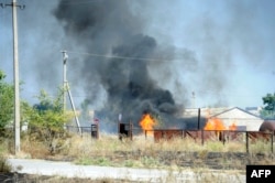 Пошкоджені будинки під час обстрілів Новоазовська 27 серпня 2014 року