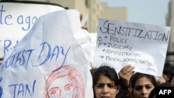 Indian lawyers shout slogans as they hold placards during a protest at the entrance to Saket District Court in New Delhi earlier this month.