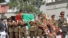 Afghan soldiers carry the coffin of slain Afghanistan High Peace Council and former President Burhanuddin Rabbani during his funeral at the Presidential Palace in Kabul on September 23, 2011.
