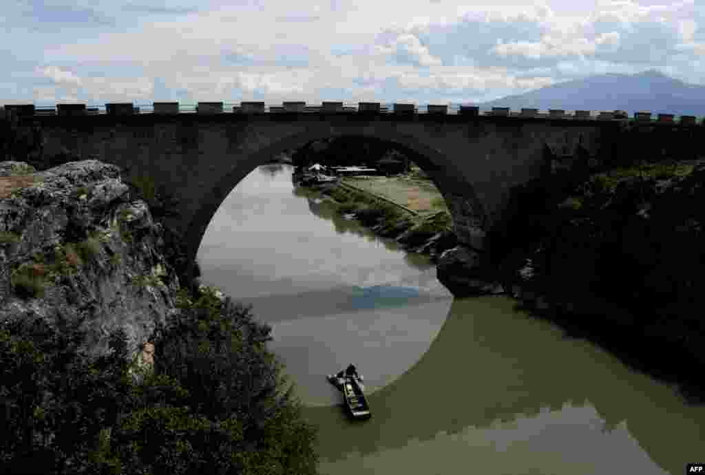 A Kosovar man fishes on the White Drin Canyon, near Gjakova in southwestern Kosovo on August 29. (AFP/Armend Nimani)