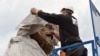 A worker covers the head of a statue of German philosopher, economist, political theorist and sociologist Karl Marx in Trier on April 13.