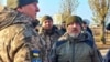 Ukrainian Defense Minister Oleksiy Reznikov (right) during a trip to Berdyansk on November 13.