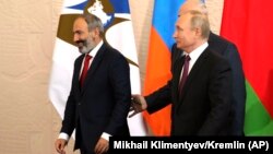 RUSSIA -- Armenian Prime Minister Nikol Pashinian (L), Belarus' President Alyaksandr Lukashenka and Russian President Vladimir Putin, walk during a Supreme Eurasian Economic Council meeting in Sochi, May 14, 2018