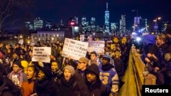 Protesters demanded justice for Eric Garner as they entered Brooklyn off the Brooklyn Bridge in New York on December 4.