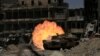 A tank fires at Islamic State militants in the Old City of Mosul on July 5.