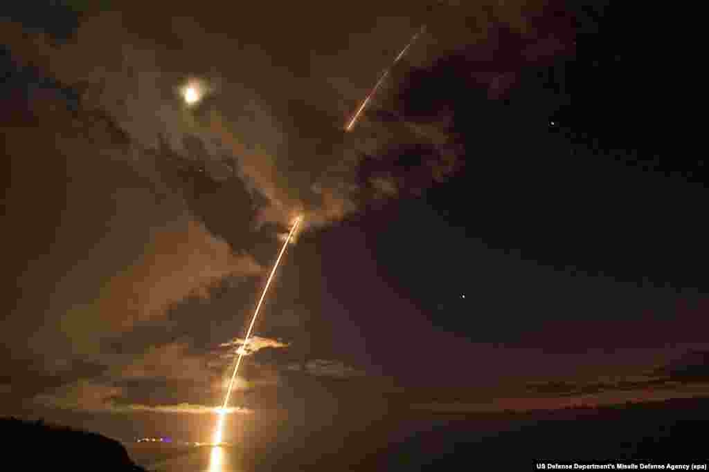 A medium-range ballistic-missile target is launched from the Pacific Missile Range Facility, before being successfully intercepted by Standard Missile-6 missiles fired from the guided-missile destroyer USS John Paul Jones, in Kauai, Hawaii, on August 29. (epa-EFE/Latonja Martin)