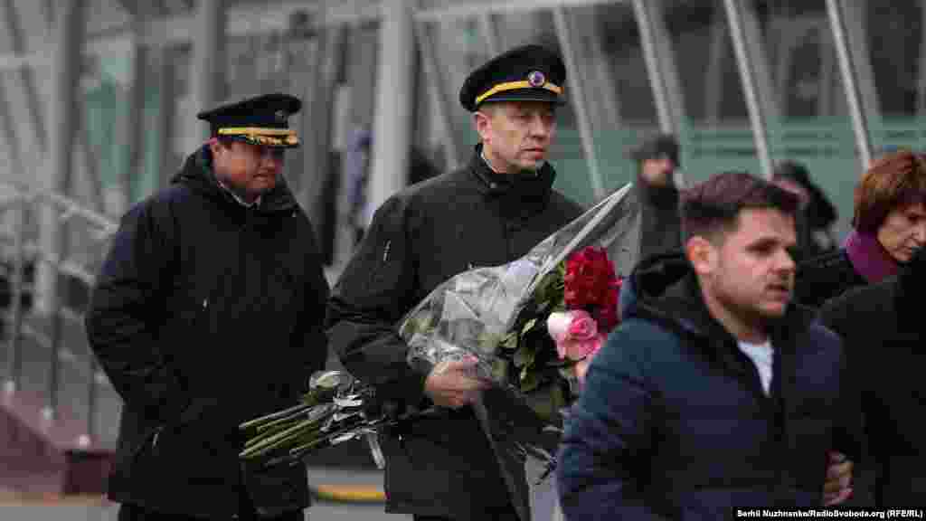 More airline colleagues attend the ceremony.