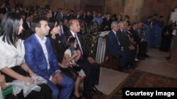 Armenia - Prime Minister Hovik Abrahamian and his son Argam (second from left) attend the consecration of a church built by them in Artashat, 31 May2015.