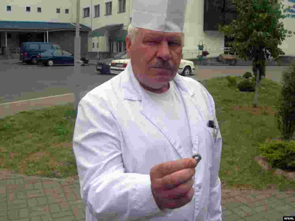 Viktar Hurko, a doctor at Minsk's Hospital No. 6, shows a piece of metal removed from a victim's body.